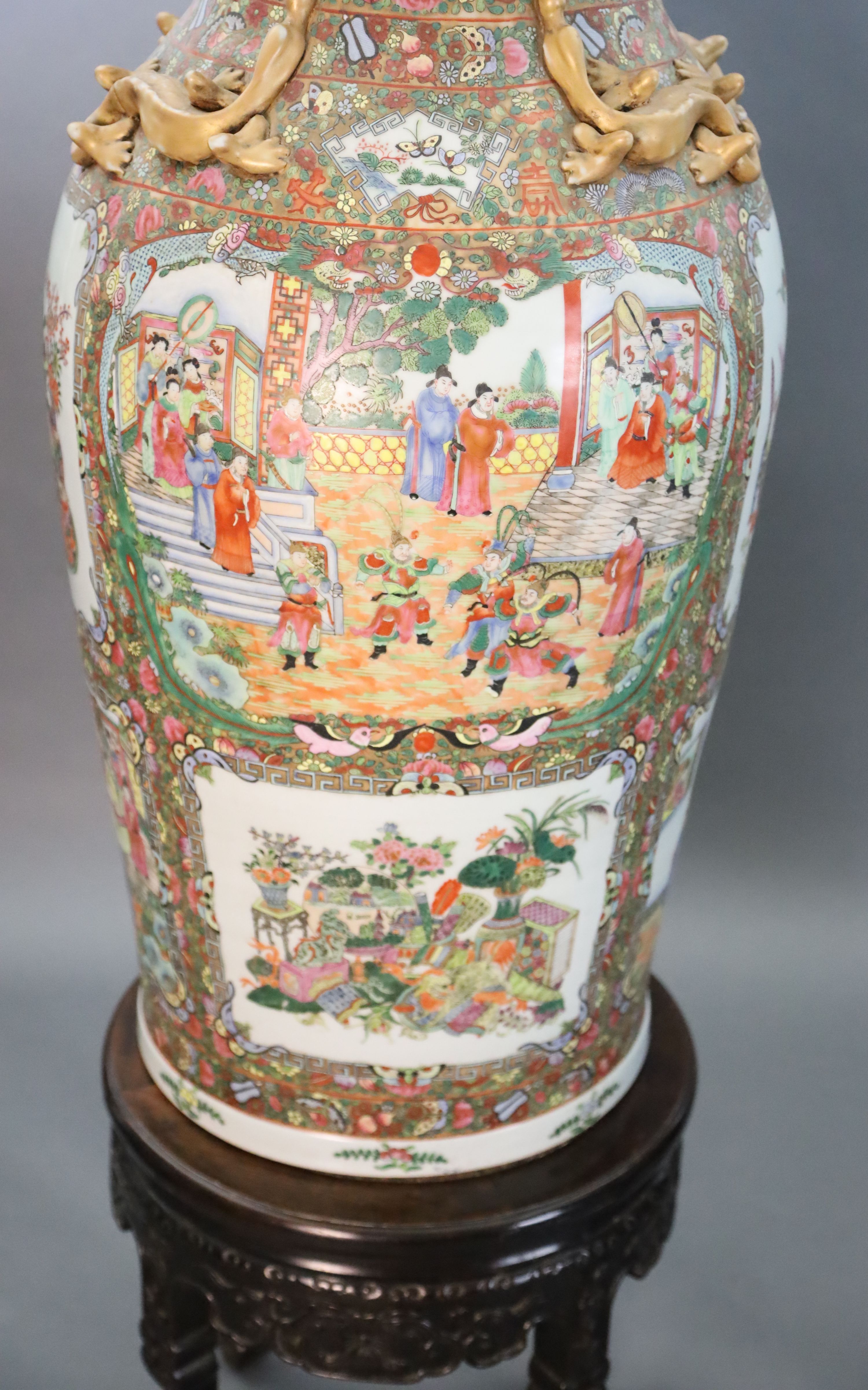 A pair of massive Chinese Canton style famille rose vases, 20th century and a pair of Chinese hongmu and marble stands, late 19th century